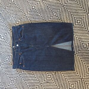 Denim skirt with front slit.